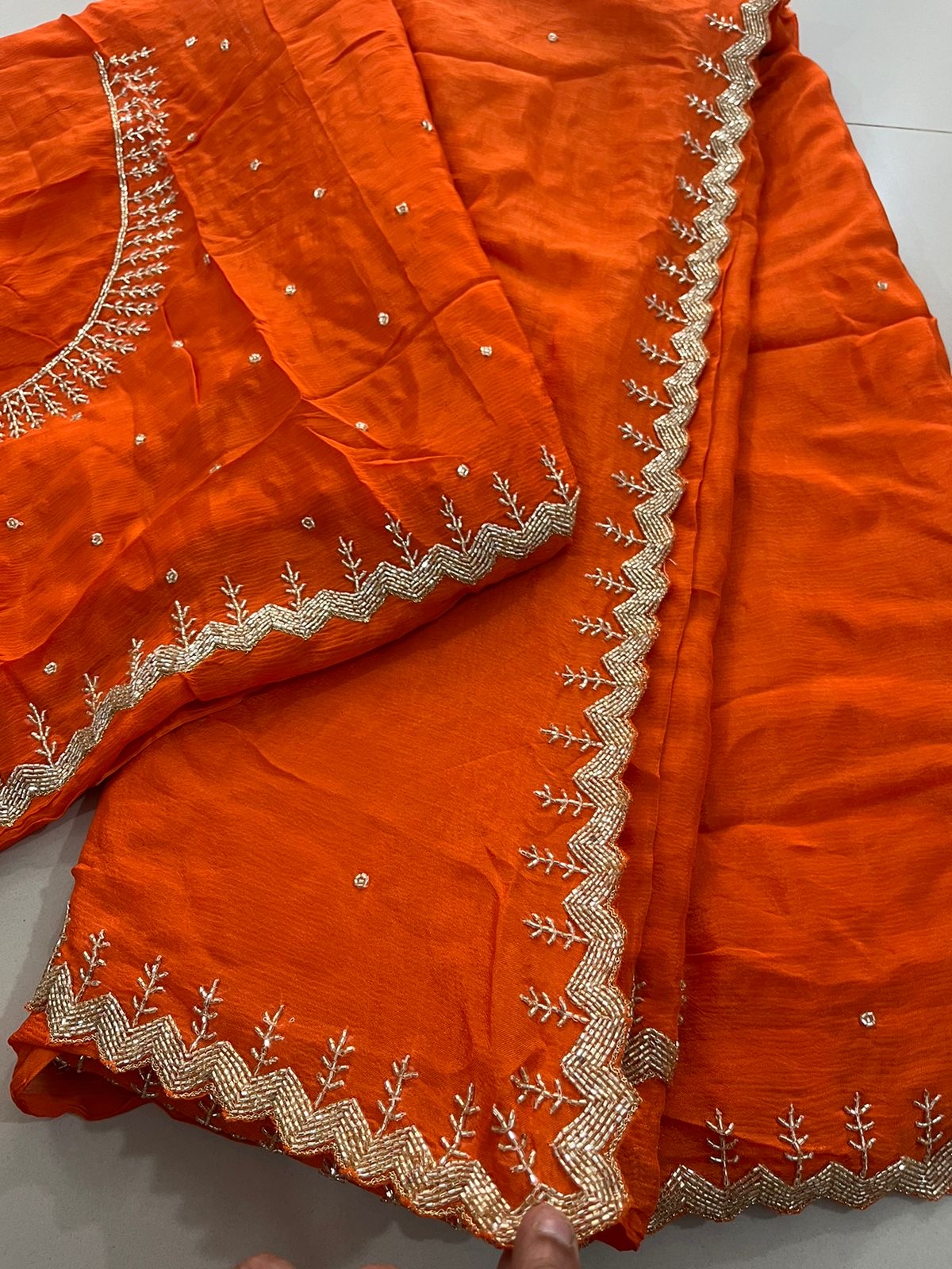 "Yashvi" Beautiful orange Pure Chinnon handwork saree