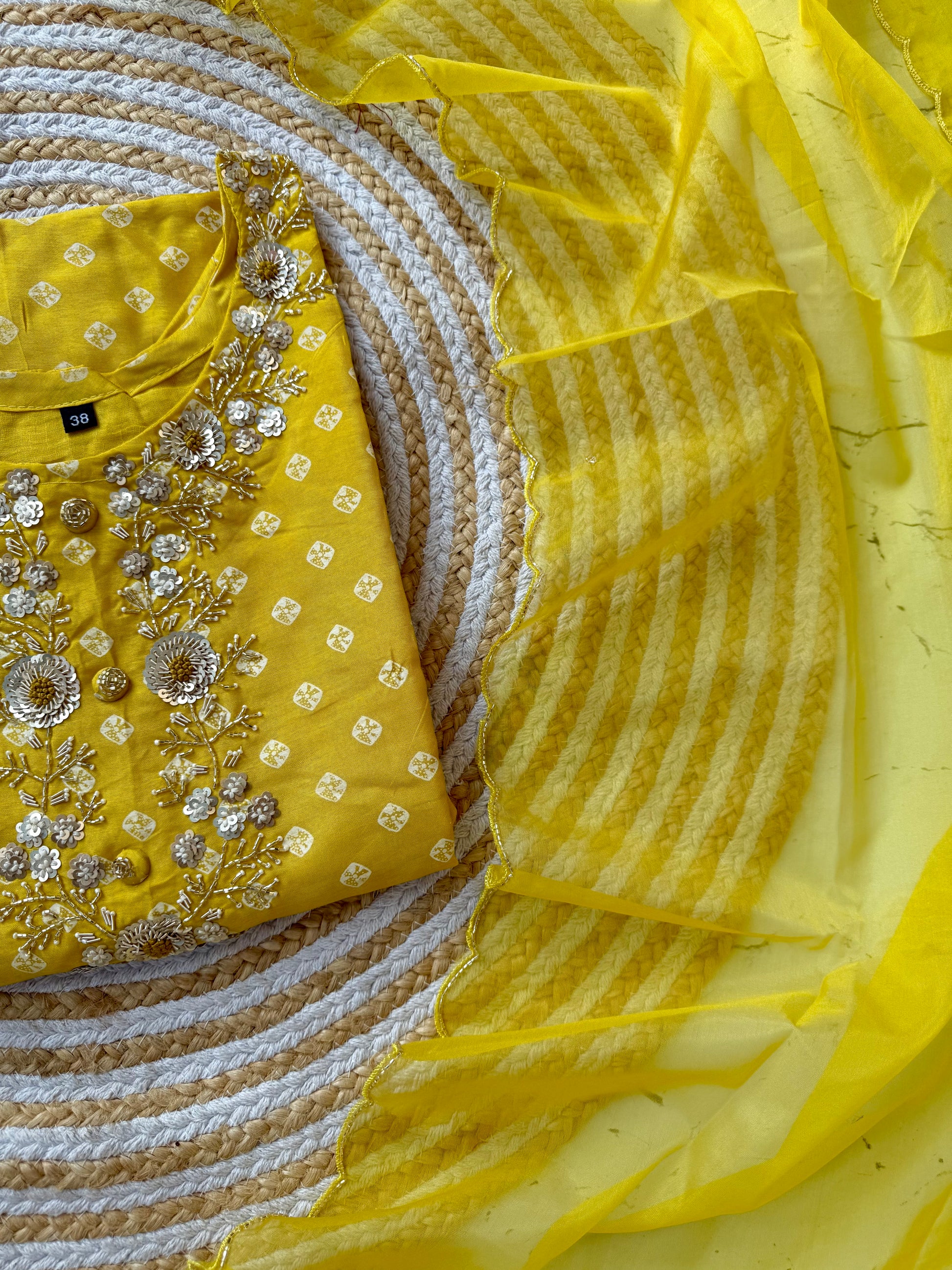 ‘’ BHANDEJ” Beautiful yellow shade bhandej dola silk set