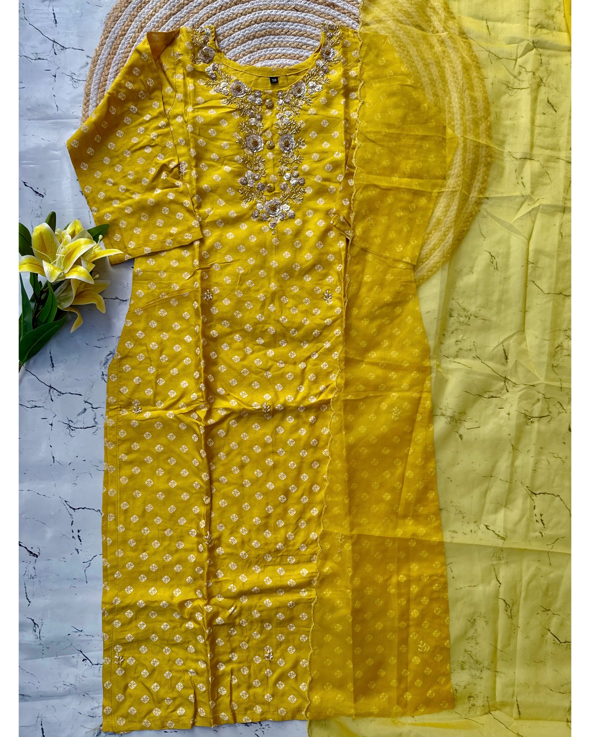 ‘’ BHANDEJ” Beautiful yellow shade bhandej dola silk set